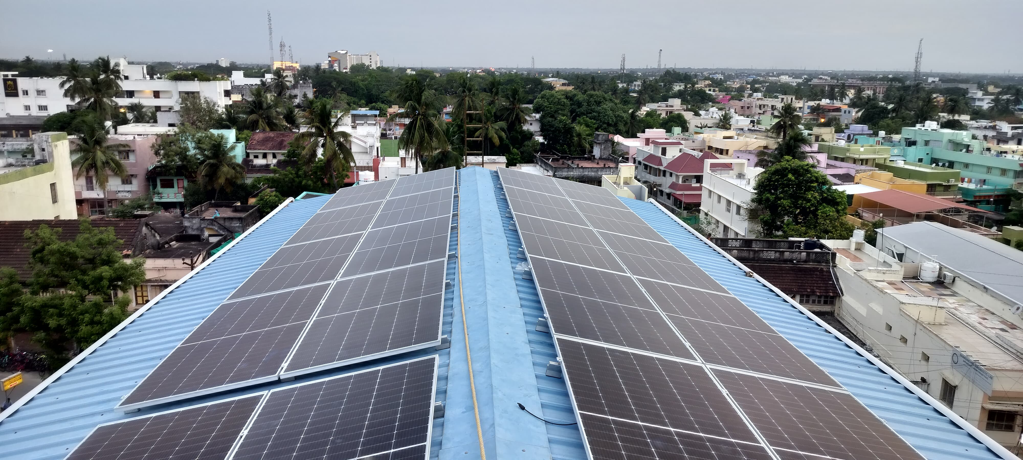 Solar rooftop building with city skyline